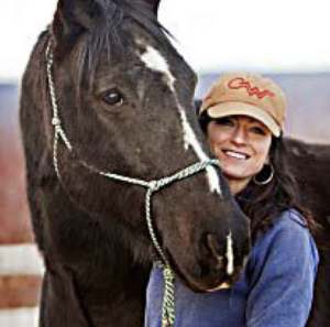 portrait of Alicia Nofli with a brown horse