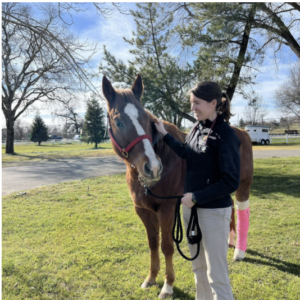 picture of Kelly Shaw with a brown and white horse