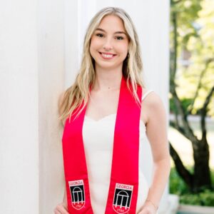 blonde-haired woman wearing red honors scarf