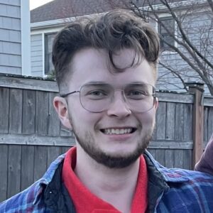 brown-haired man wearing glasses